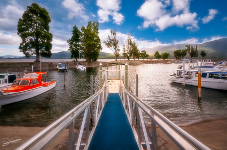 Jetty perspective and scenic view at Te Anau Boating Club Marina, New Zealand