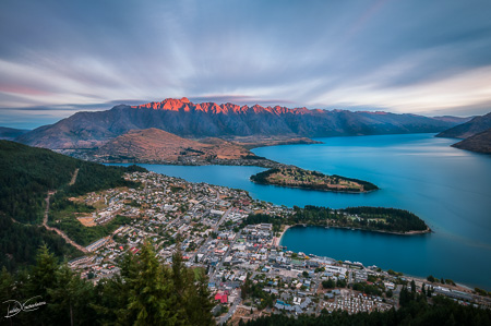 The Remarkables Mountain burning with a red light at sunset in Queenstown, NZ. 