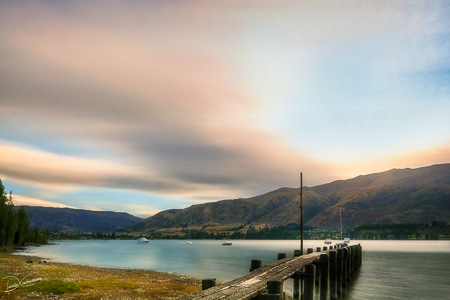 Sunlight at Wanaka Lake old pier in New Zealand