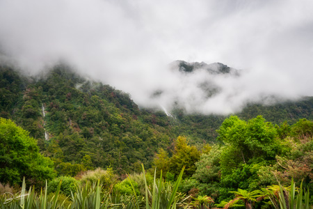 Mountain view covered in the mist at Haast Pass in New Zealand